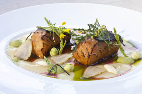 Torched Wild Black Cod, Seabean-Garbanzo "Hummus," Almond Ponzu, Pickled Green Almonds, Compressed Green Strawberries, Pomegranate, and Seaweed Oil by Chef Brad Kilgore. Photo by Battman.