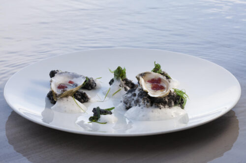 Oysters with Mignonette Gelee Presented in their "Natural Setting," Squid Ink "Rocks," Verjus Sea Froth, Wakame by Chef Brad Kilgore. Photo by Battman.