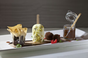 Warm & Crispy Chocolate Cake with a Saffron Kulfi Pop, Cardamom Ginger Truffles, and Apricot Confit by Executive Pastry Chef Michael Mignano