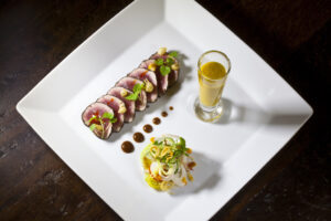 Tuna Carpaccio with a Tamarind Soy Sauce, Mango-Basil Gazpacho, and Palm Hearts Salad from Executive Chef Ashfer Biju
