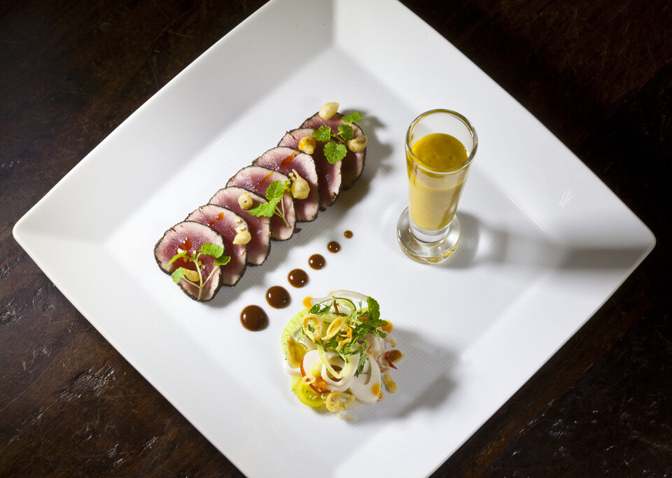 Tuna Carpaccio with a Tamarind Soy Sauce, Mango-Basil Gazpacho, and Palm Hearts Salad from Executive Chef Ashfer Biju