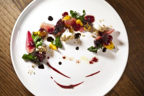 Roasted golden candy cane and red baby beets, goat cheese, hazelnuts, aged balsamic and beet vinaigrette