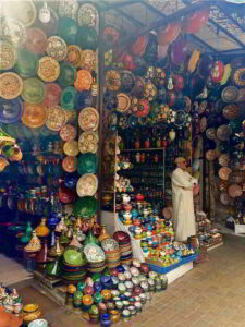 Image of pottery and shopkeeper.