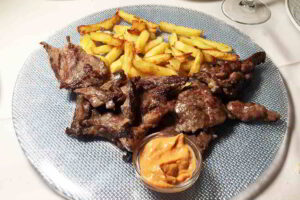 Streak and fries in Seville, Spain. Photo by Battman.