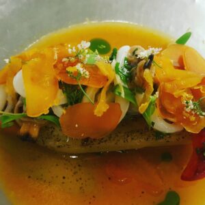 Chilled Local Eggplant, Squid, Cockles, Bottarga Di Muggini, Garden Herbs, Spicy Tomato Vinaigrette by Chef Juan Cuevas