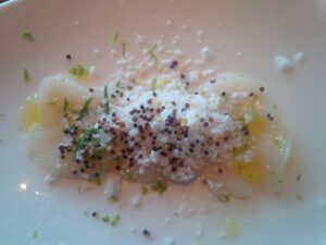 Scallop crudo, frozen horseradish, crispy quinoa, chilis, lime by Chef Juan Cuevas