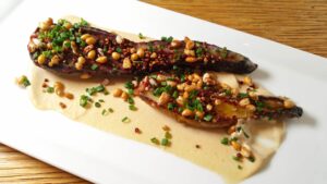 Japanese eggplant with cashew butter and puffed grains by Chef Suzanne Cupps. Photo by Battman.