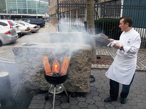 Chef Ari Nieminen preparing smoked salmon for the Street Eats book. Photo by Battman.