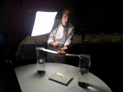 Chef Eric Ripert preparing his dish for the Street Eats book. Photo by Battman.