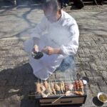 Chef Jean-George Vongerichten cooking on the sidewalk in NYC for the Street Eats book. Photo by Battman.