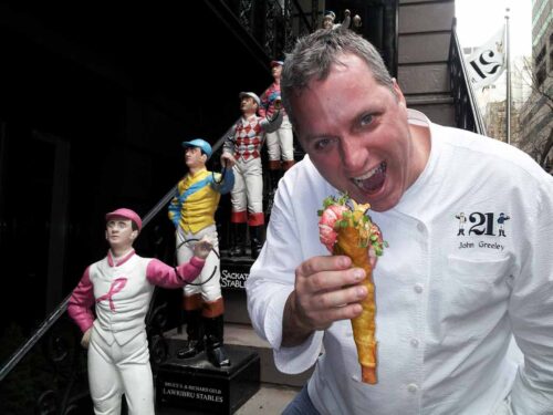 Chef John Greeley takes a bite out of his dish for the Street Eats book. Photo by Battman.